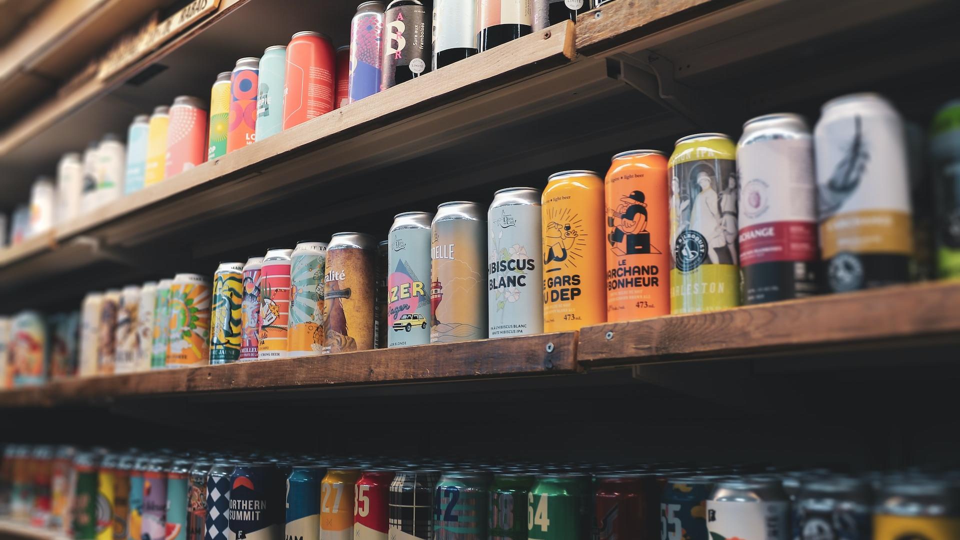 assorted plastic bottles on brown wooden shelf